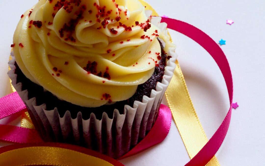 photo of cupcake by Photo by Jess Bailey Designs: https://www.pexels.com/photo/chocolate-cupcake-with-white-and-red-toppings-913136/