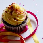 photo of cupcake by Photo by Jess Bailey Designs: https://www.pexels.com/photo/chocolate-cupcake-with-white-and-red-toppings-913136/